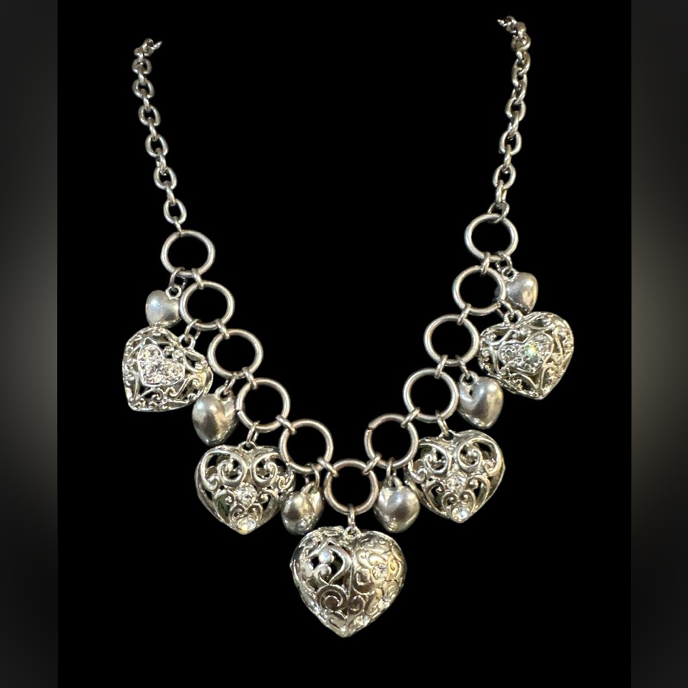CHUNKY HEART NECKLACE WITH EMBEDDED WHITE STONES.